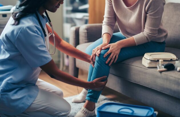 Doctor providing diabetic foot ulcer treatment to patient in Fayetteville GA
